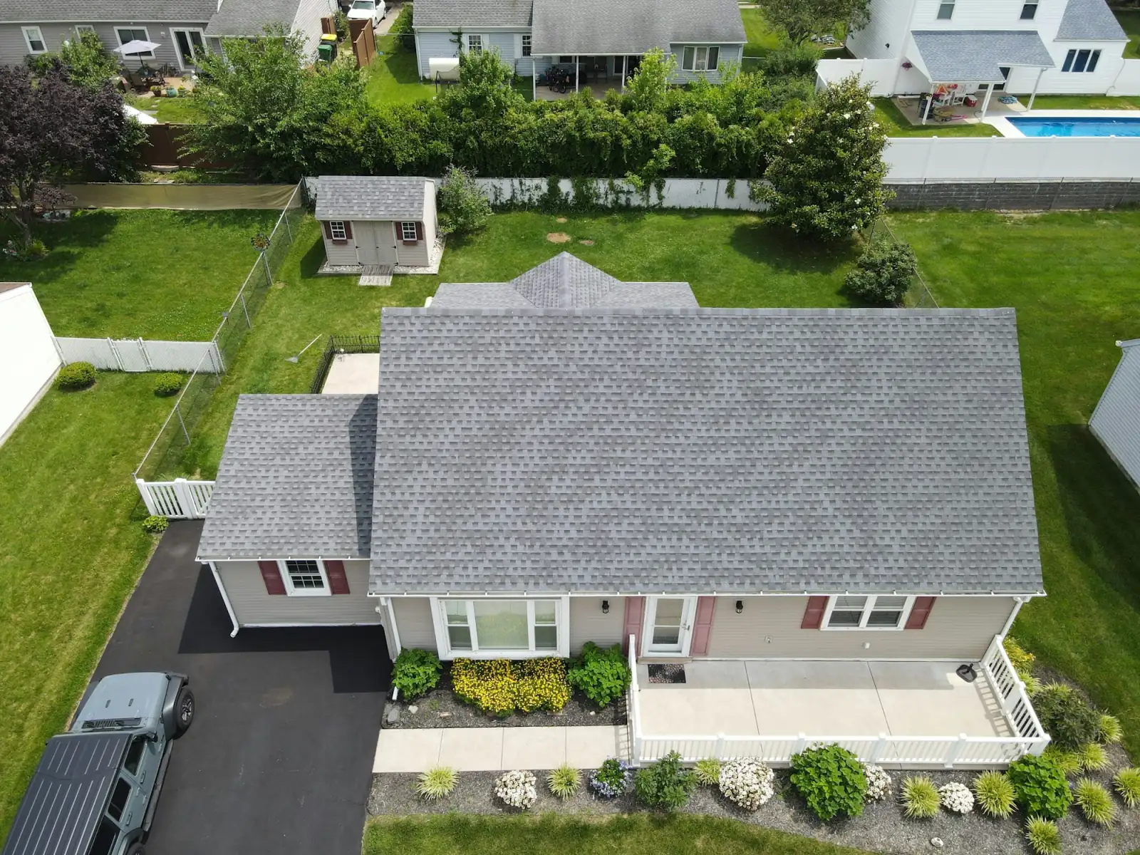 A crew finishing a shingle roof